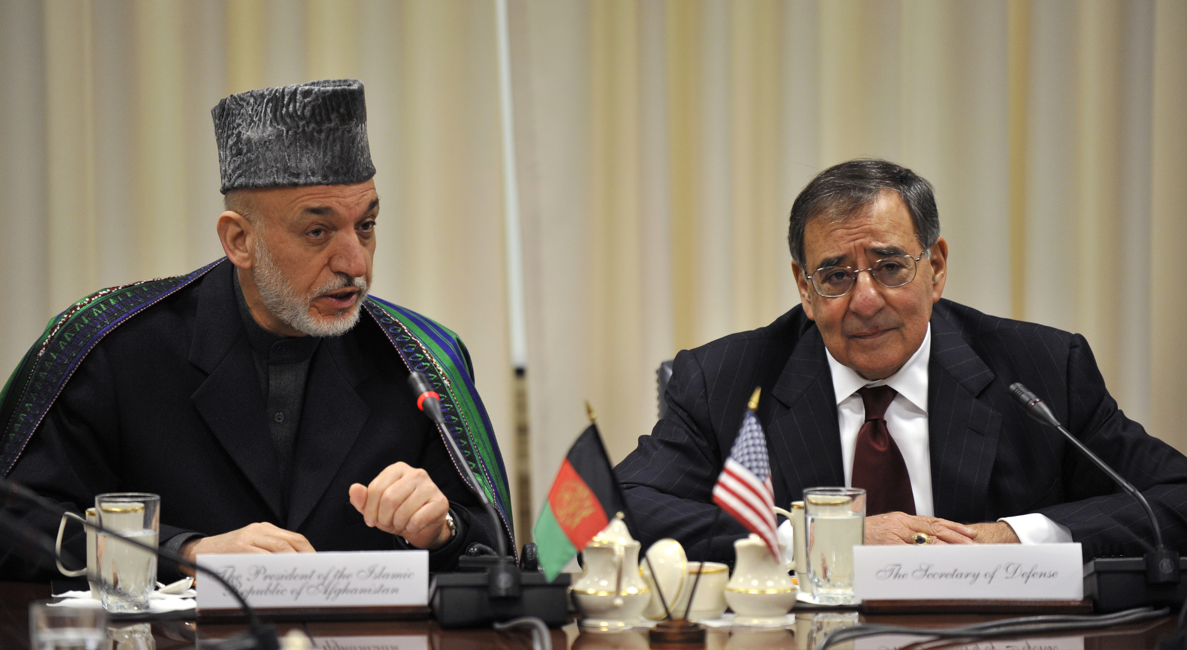 Afghanistan's President Hamid Karzai, left, makes his opening statement at the top of a meeting with Secretary of Defense Leon E. Panetta, right, and their senior advisors in the Pentagon 130110-D-NI589-543