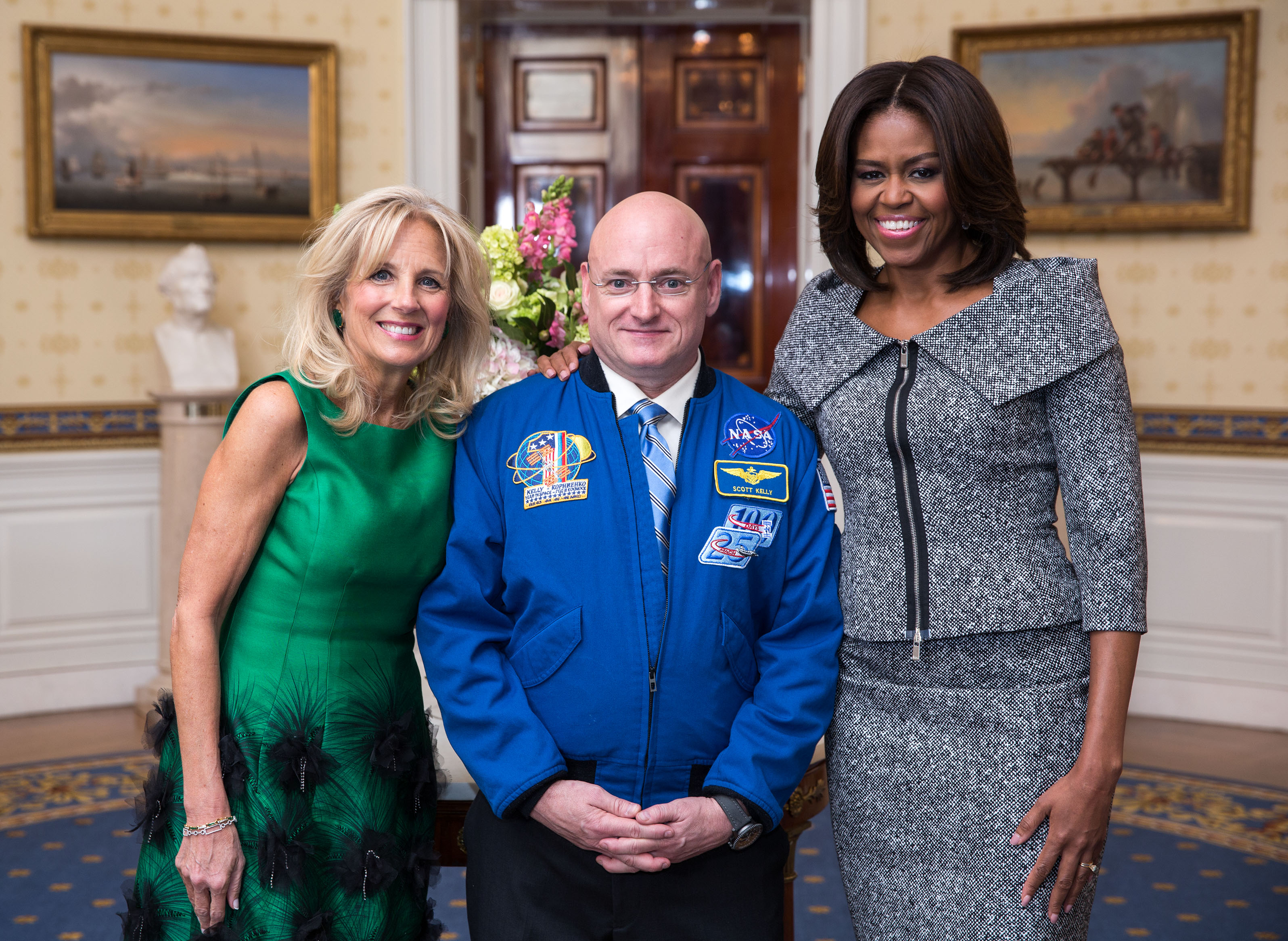 First Lady Michelle Obama and Dr. Jill Biden greet Scott Kelly, First Lady's State of the Union box guest, in the Blue Room of the White House, Jan. 20, 2015