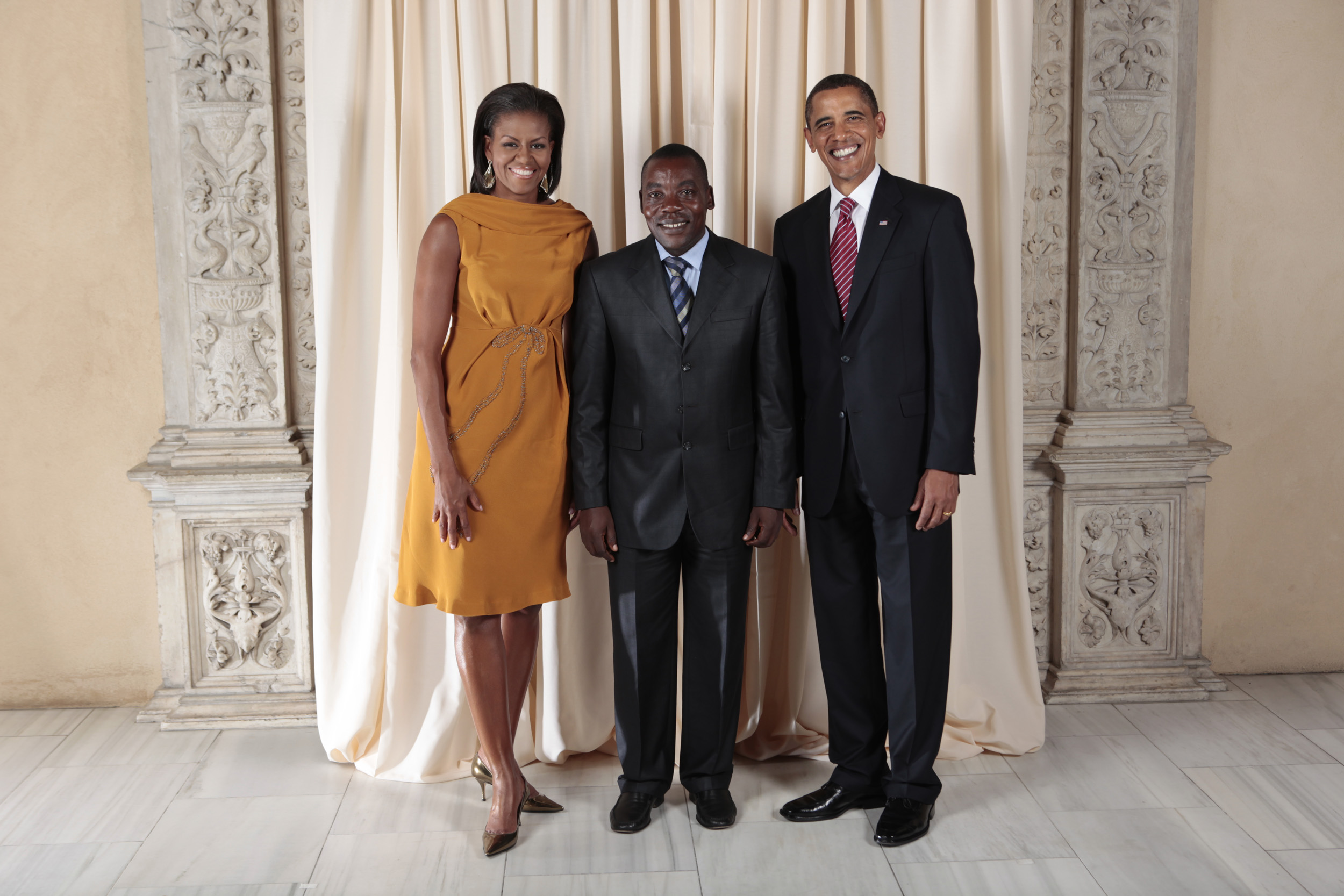 Gabriel Ntisezerana with Obamas