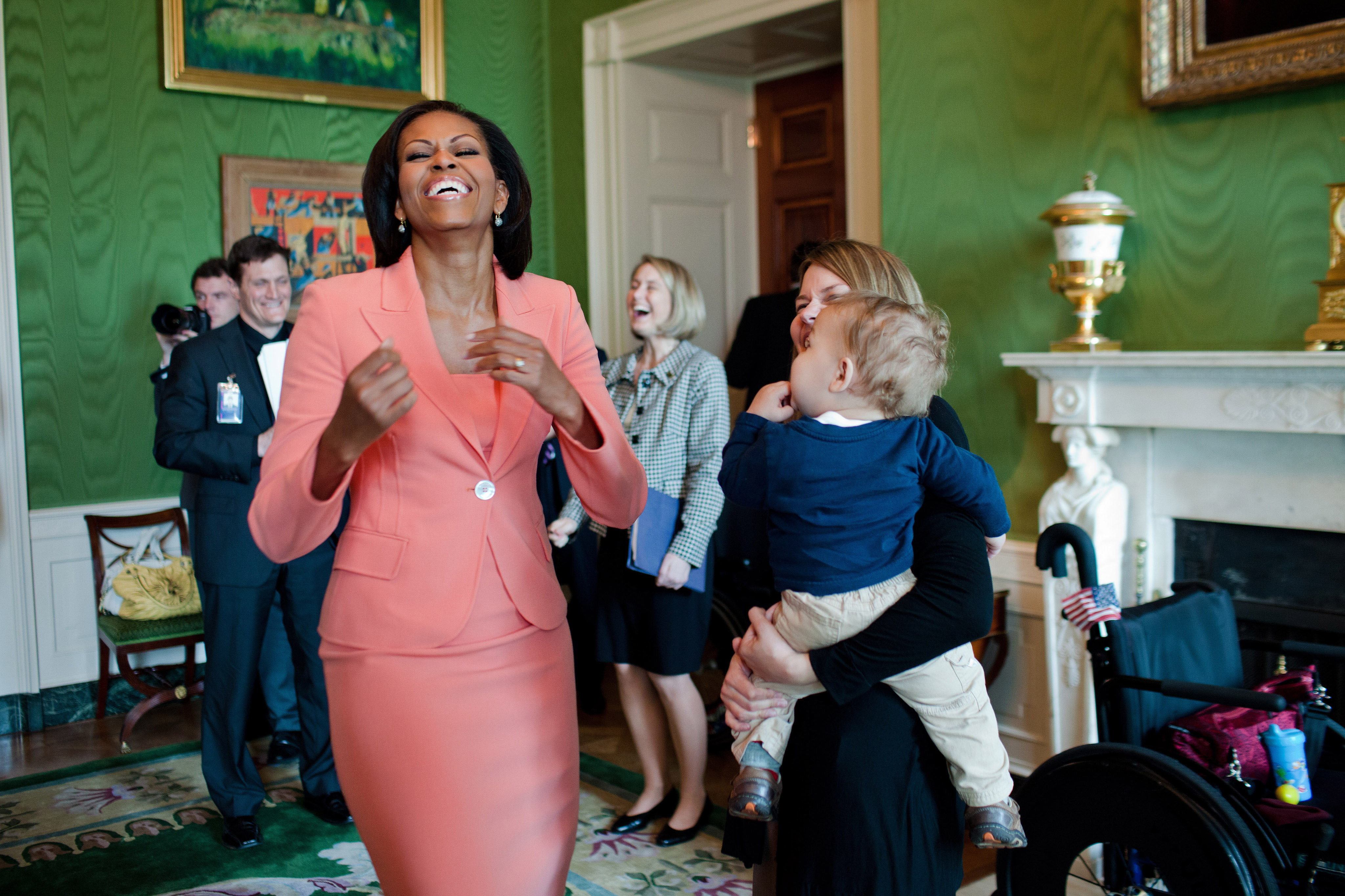 Michelle Obama laughs in the Green Room of the White House, 2011