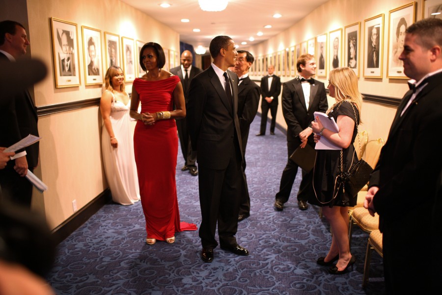 Barack and Michelle Obama wait in a hallway at the Washington Hilton Hotel, 2019