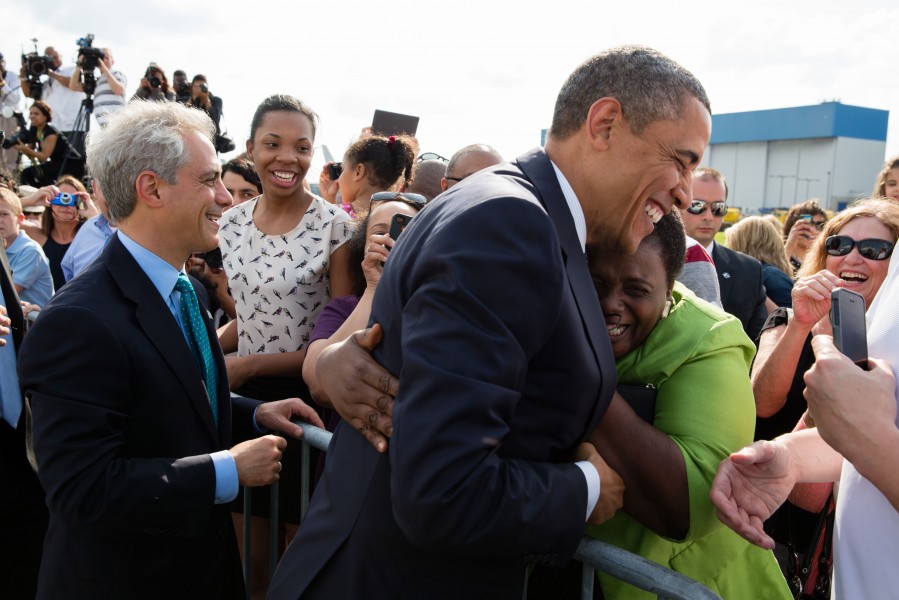 Barack Obama and Chicago Mayor Rahm Emanuel greet people on the tarmac at Chicago O'Hare International Airport, 2013