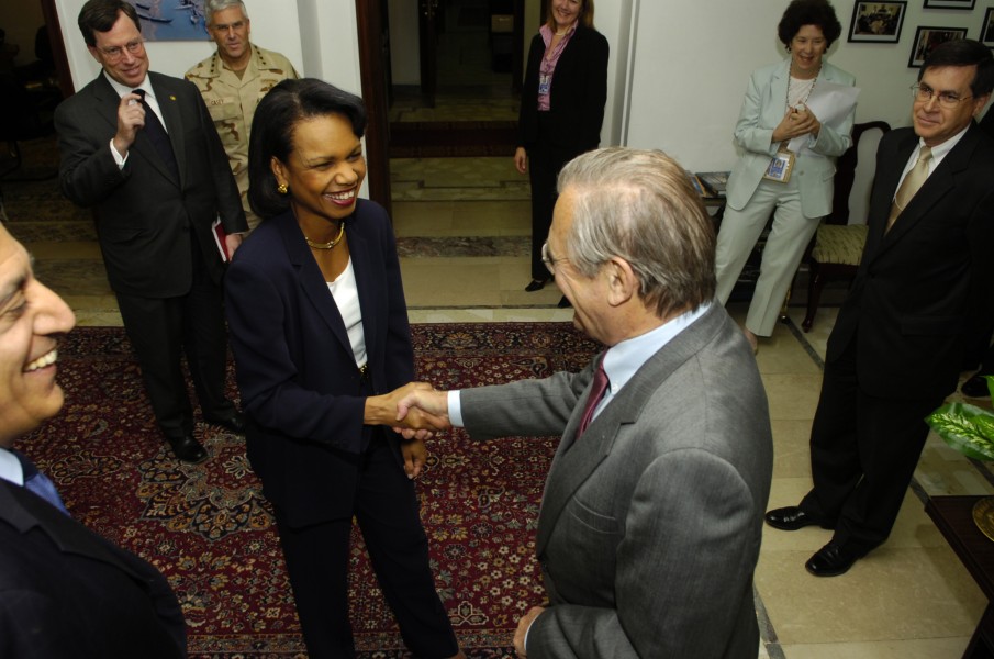 Donald Rumsfeld greets Secretary of State Condoleezza Rice in Baghdad, Iraq, on April 26, 2006