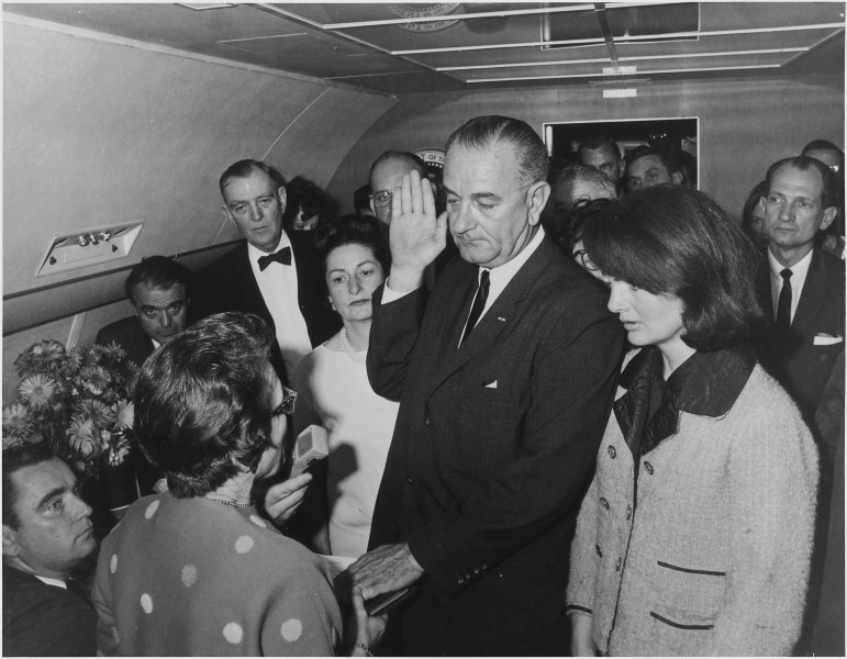 Lyndon Baines Johnson takes Presidential Oath of Office. Jay Gildner, Judge Sarah Hughes, Jack Valenti, Congressman... - NARA - 194235