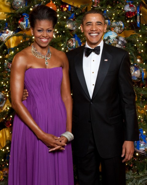 Michelle and Barack Obama pose in front of the official White House Christmas Tree (cropped)
