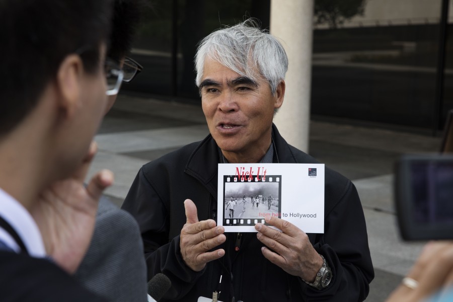 Nick Ut speaks with the press