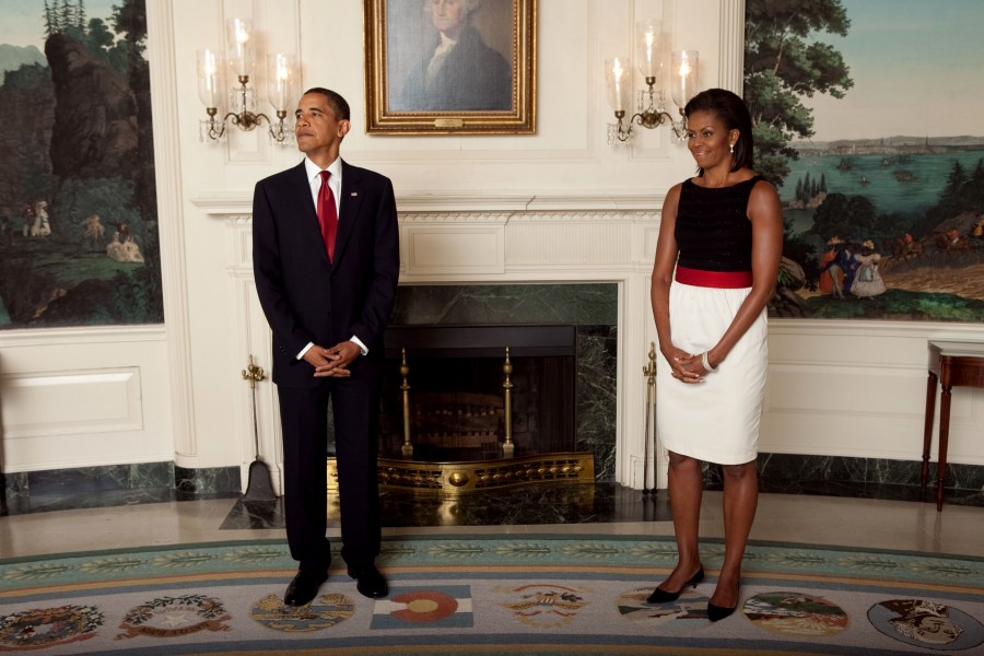 President Barack Obama and First Lady Michelle wait for the start of a receiving line at the Ambassadors Reception in the White House