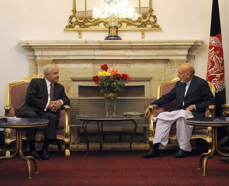 U.S. Secretary of Defense Robert M. Gates, left, talks with Afghan President Hamid Karzai at the Presidential Palace in Kabul, Afghanistan, Sept 100902-F-DQ383-009