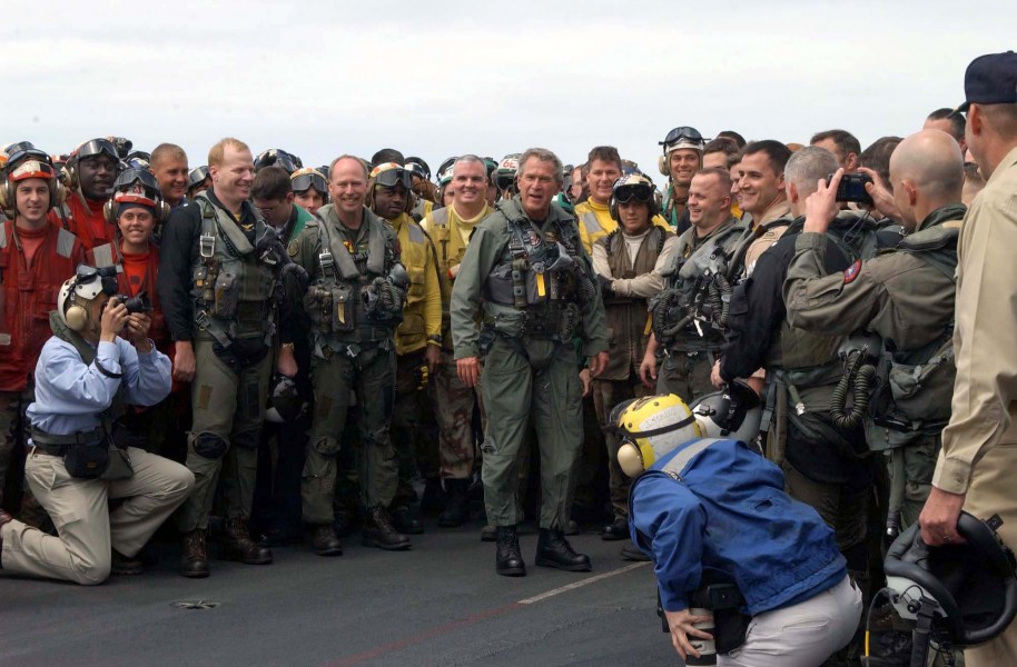 US Navy 030501-N-8479H-020 President George W. Bush greets sailors on the flight deck after a successful trap aboard the USS Abraham Lincoln (CVN 72)