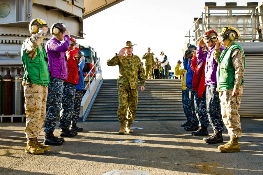 US Navy 110722-N-CZ945-090 Royal Australian Army Gen. David Hurley salutes rainbow sideboys upon his arrival aboard USS Germantown (LSD 42)