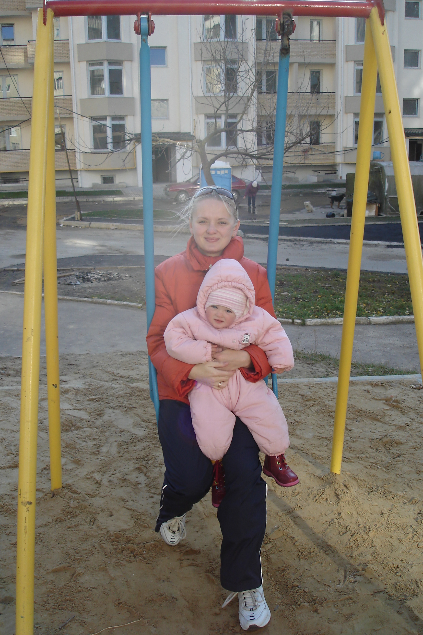 Young blond woman with her baby daughter