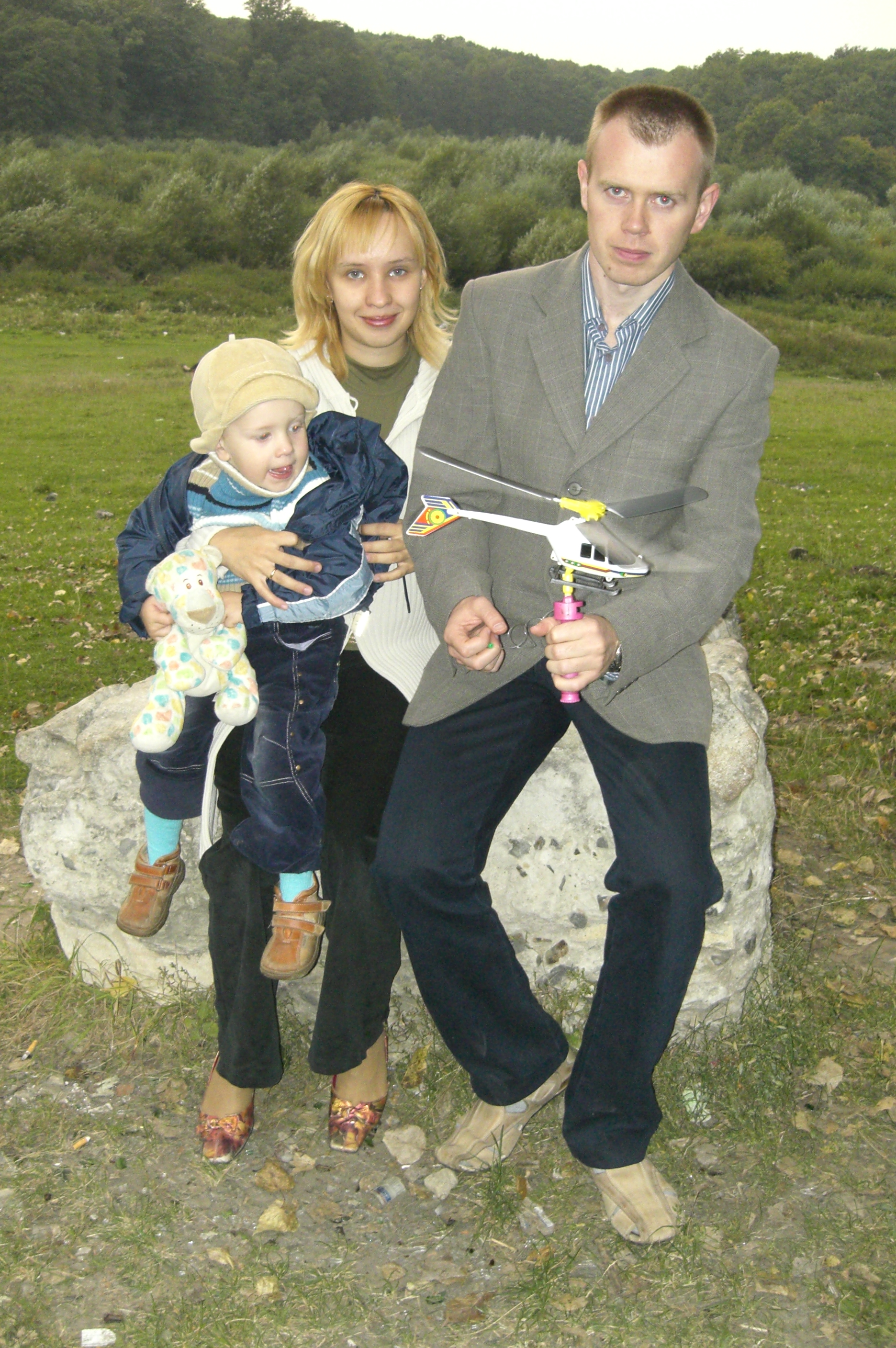 Son, his mother, his father, and his toys. Family.