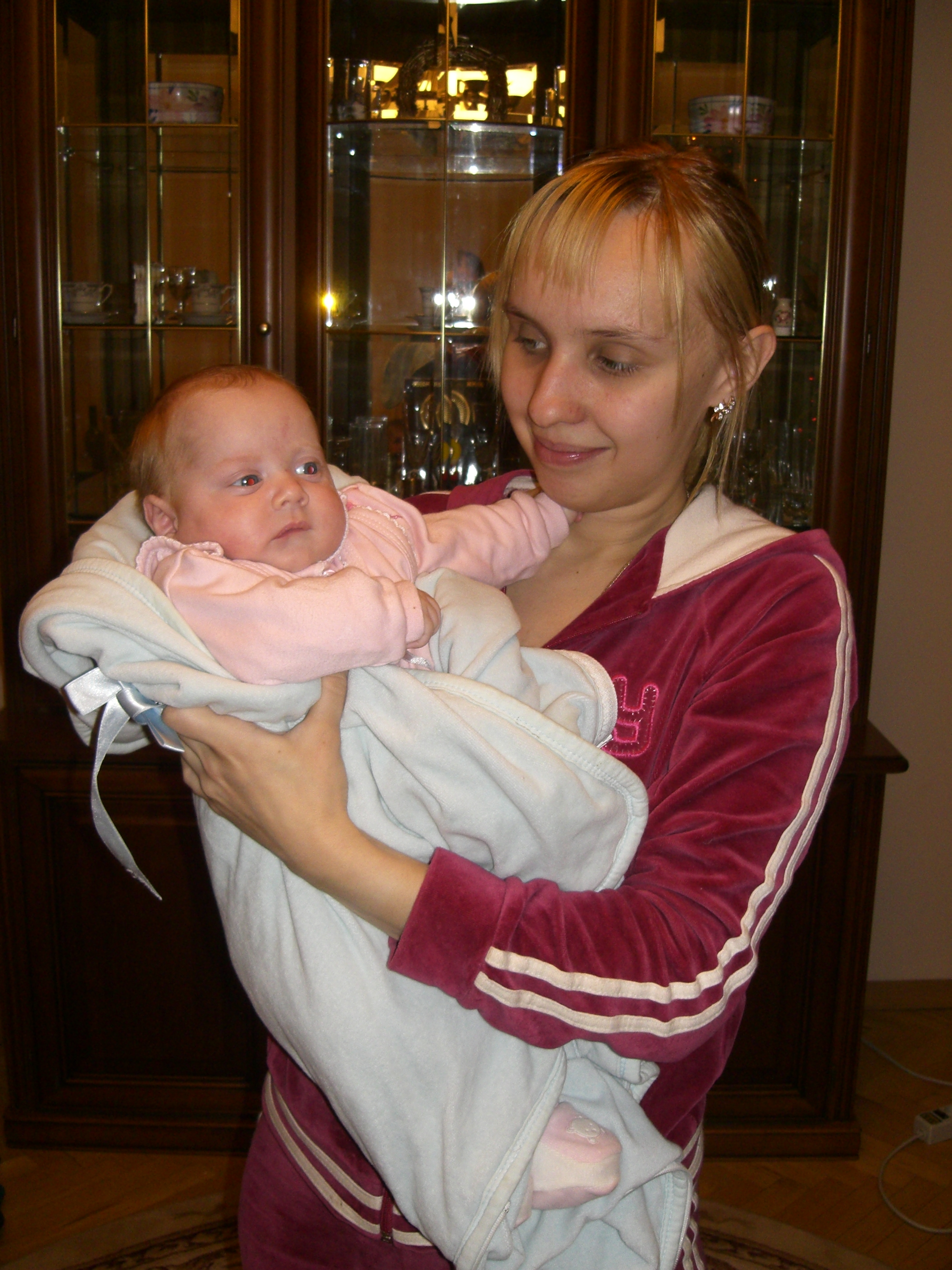 Mother with her recently born daughter, family.
