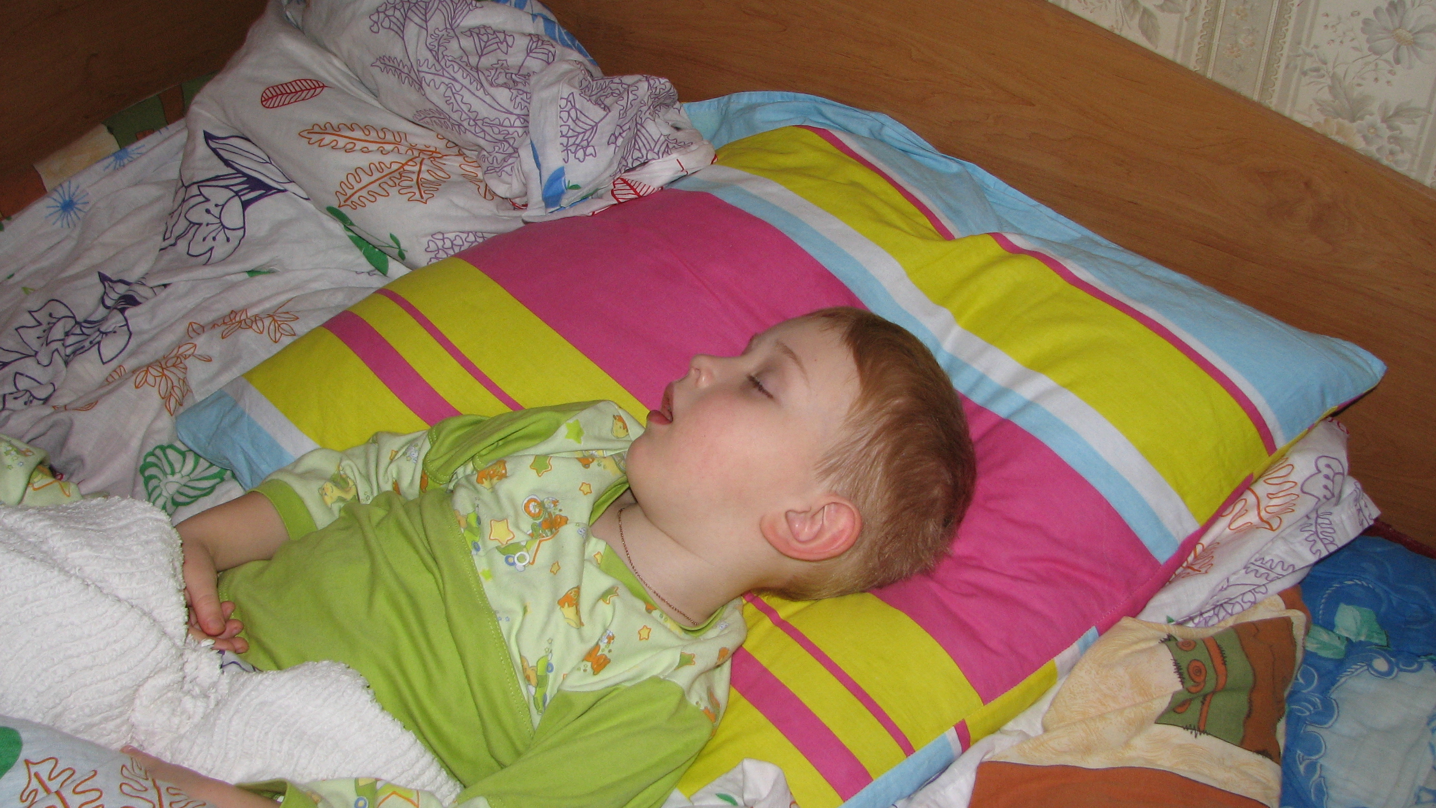 a small kid boy sleeping