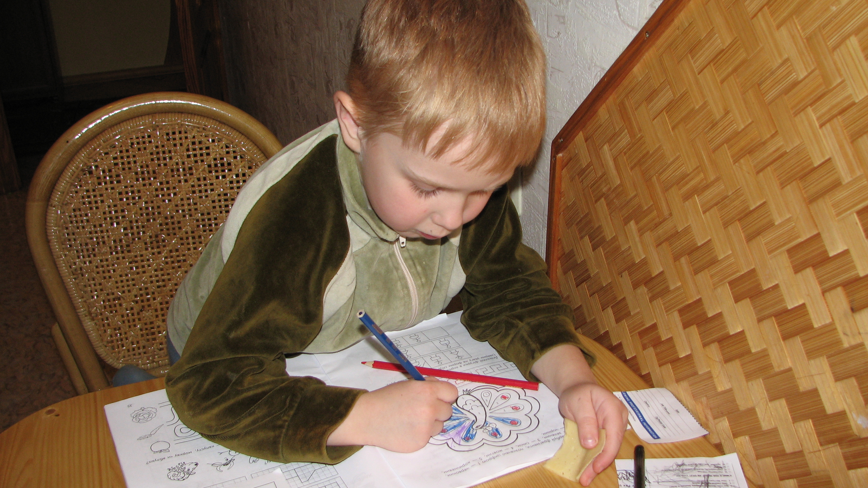 A small boy doing his first books