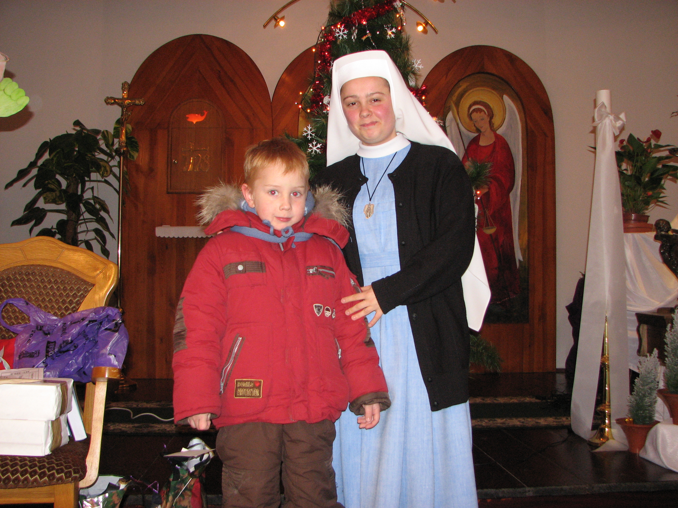 A Catholic nun with a small boy