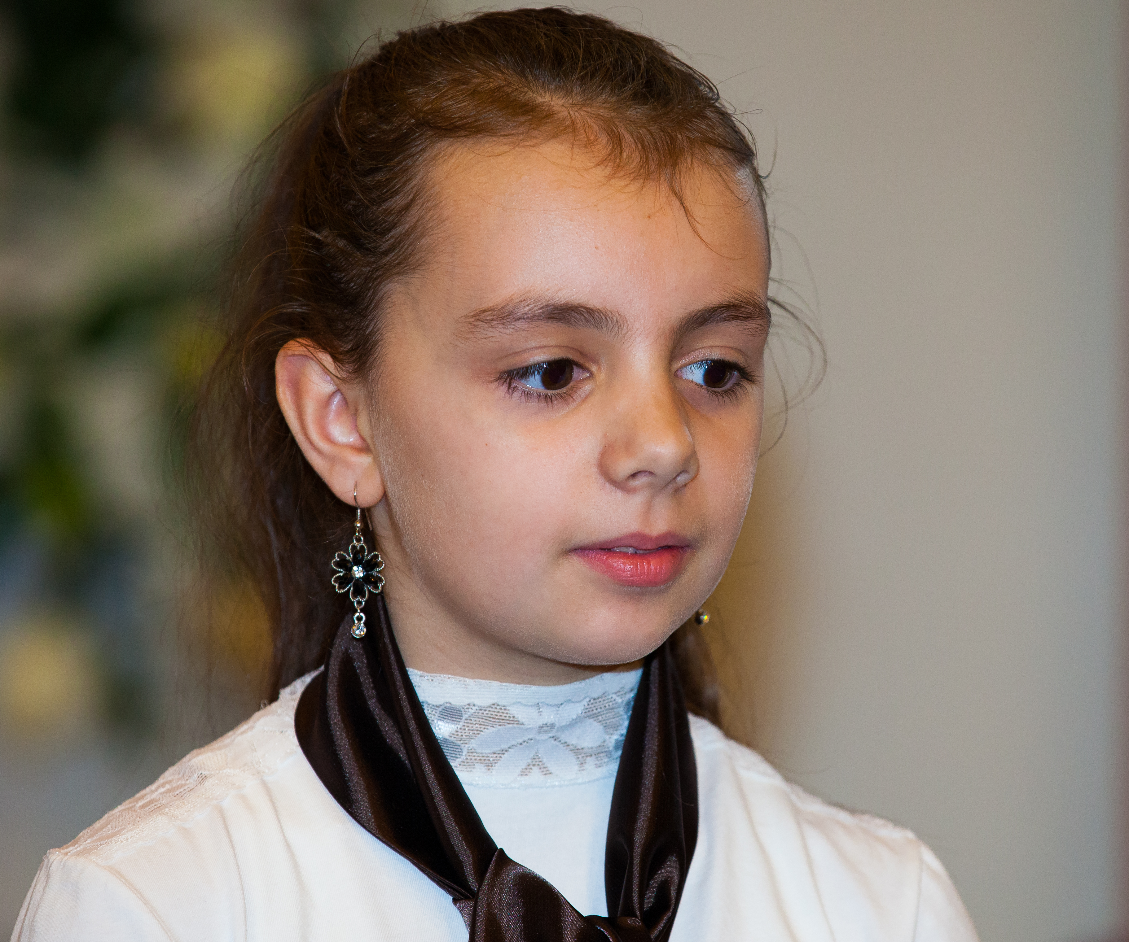 a brunette child girl in a Catholic chapel photographed in November 2013