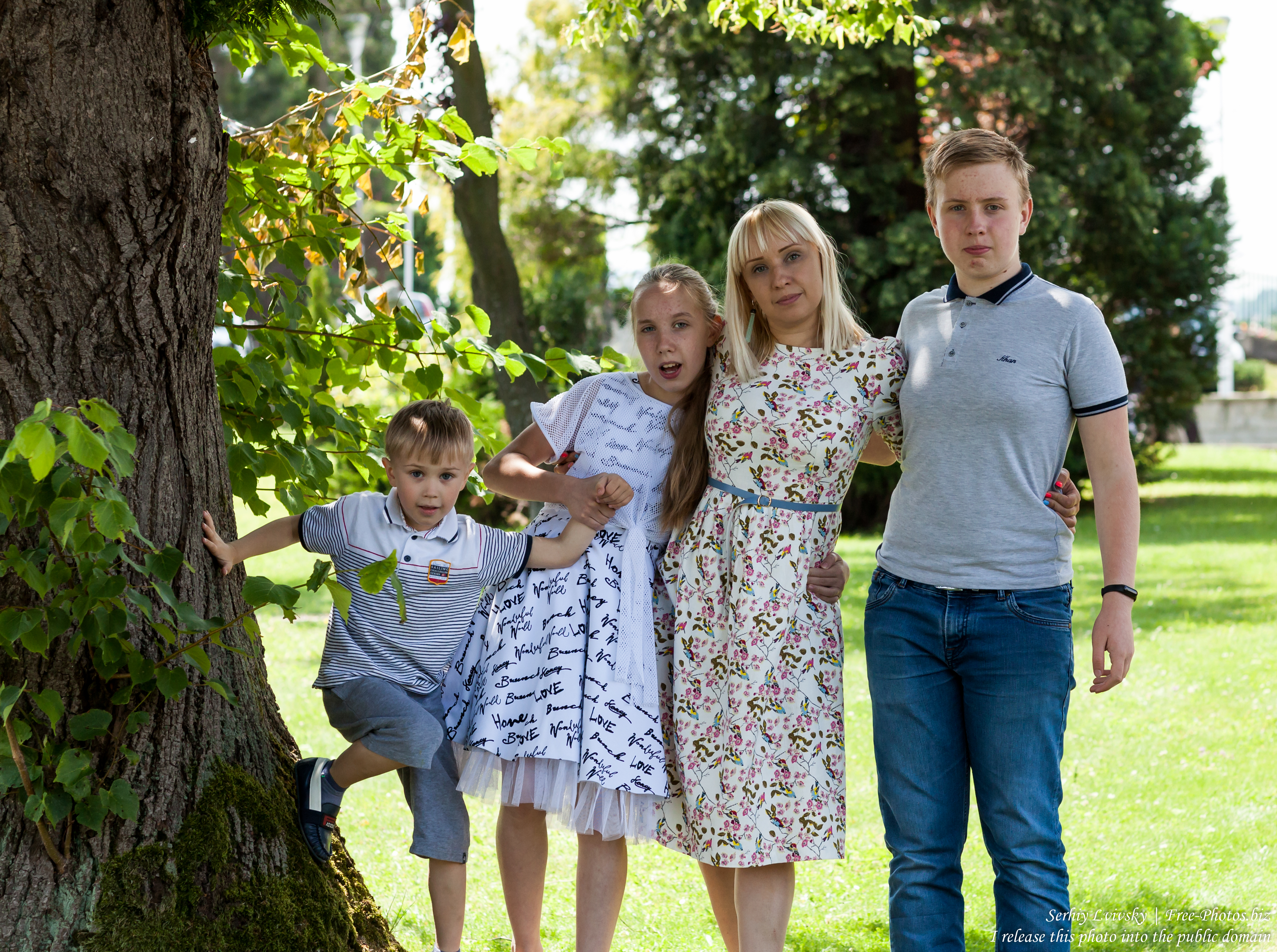 a Catholic mother with her 3 children photographed in July 2018