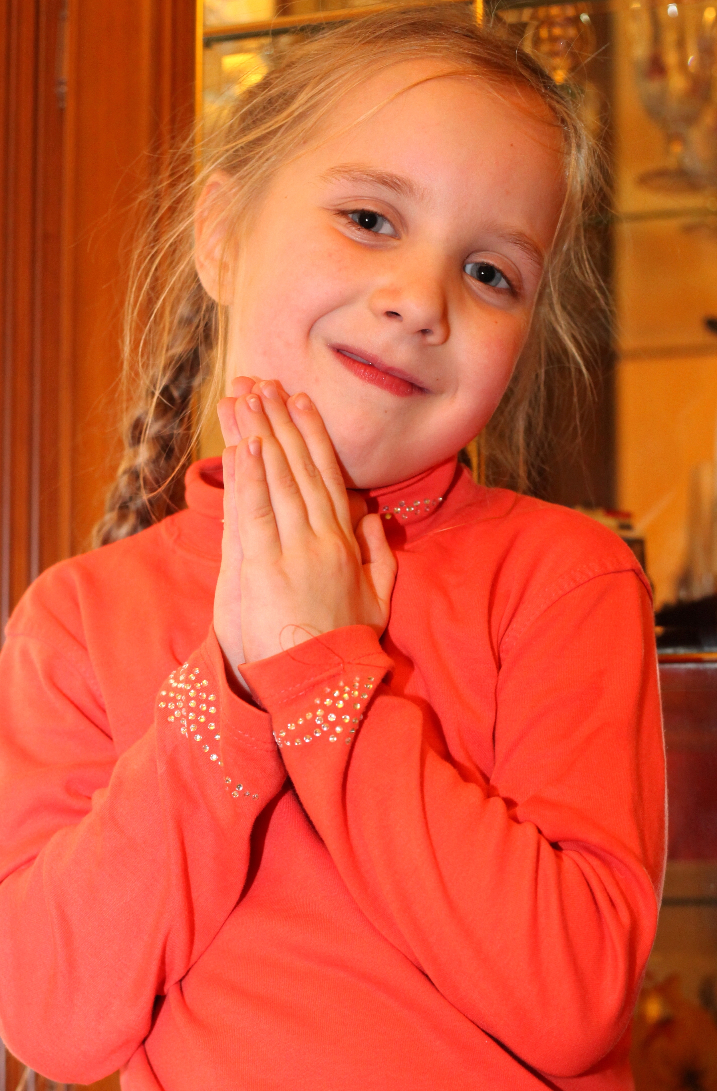 a portrait of a cute blond Catholic child girl