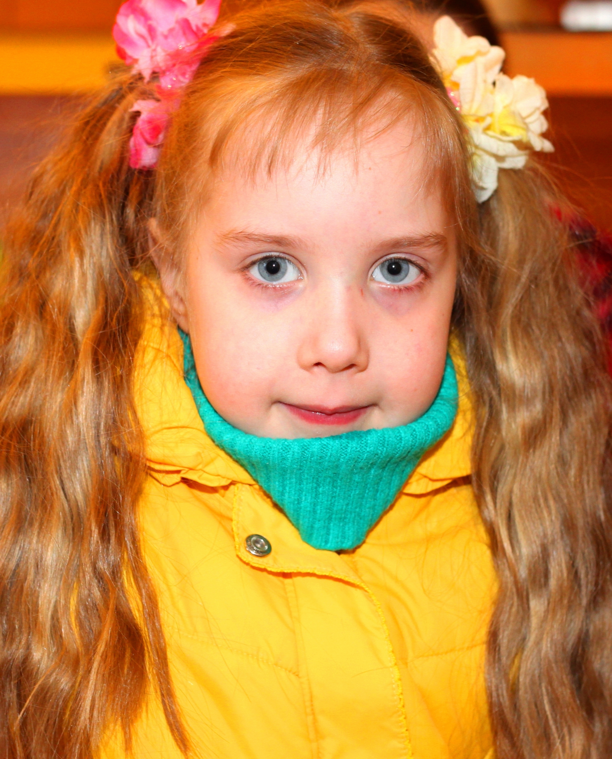 a cute blond Catholic child girl in a Church