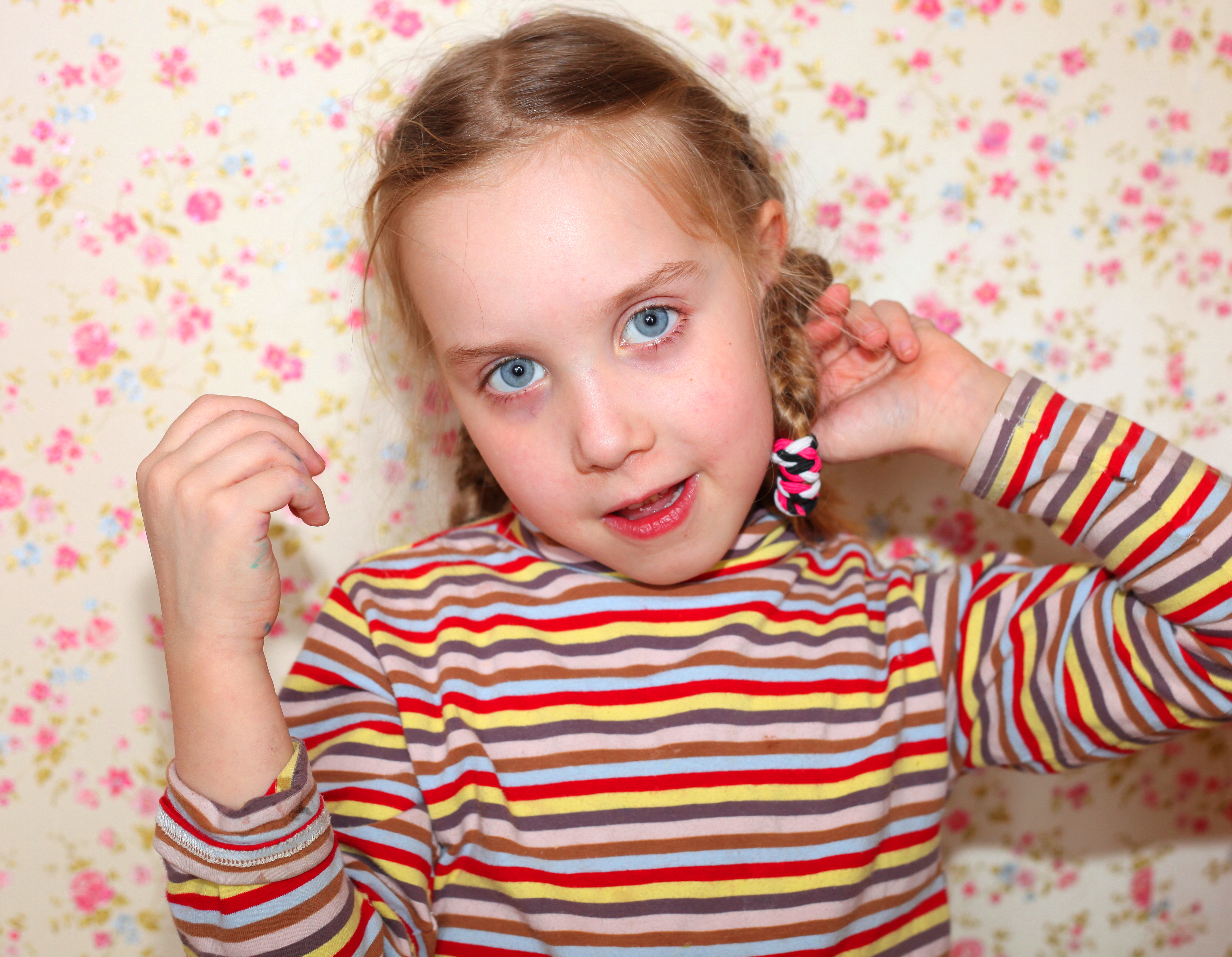 a cute fair-haired child girl with beautiful eyes