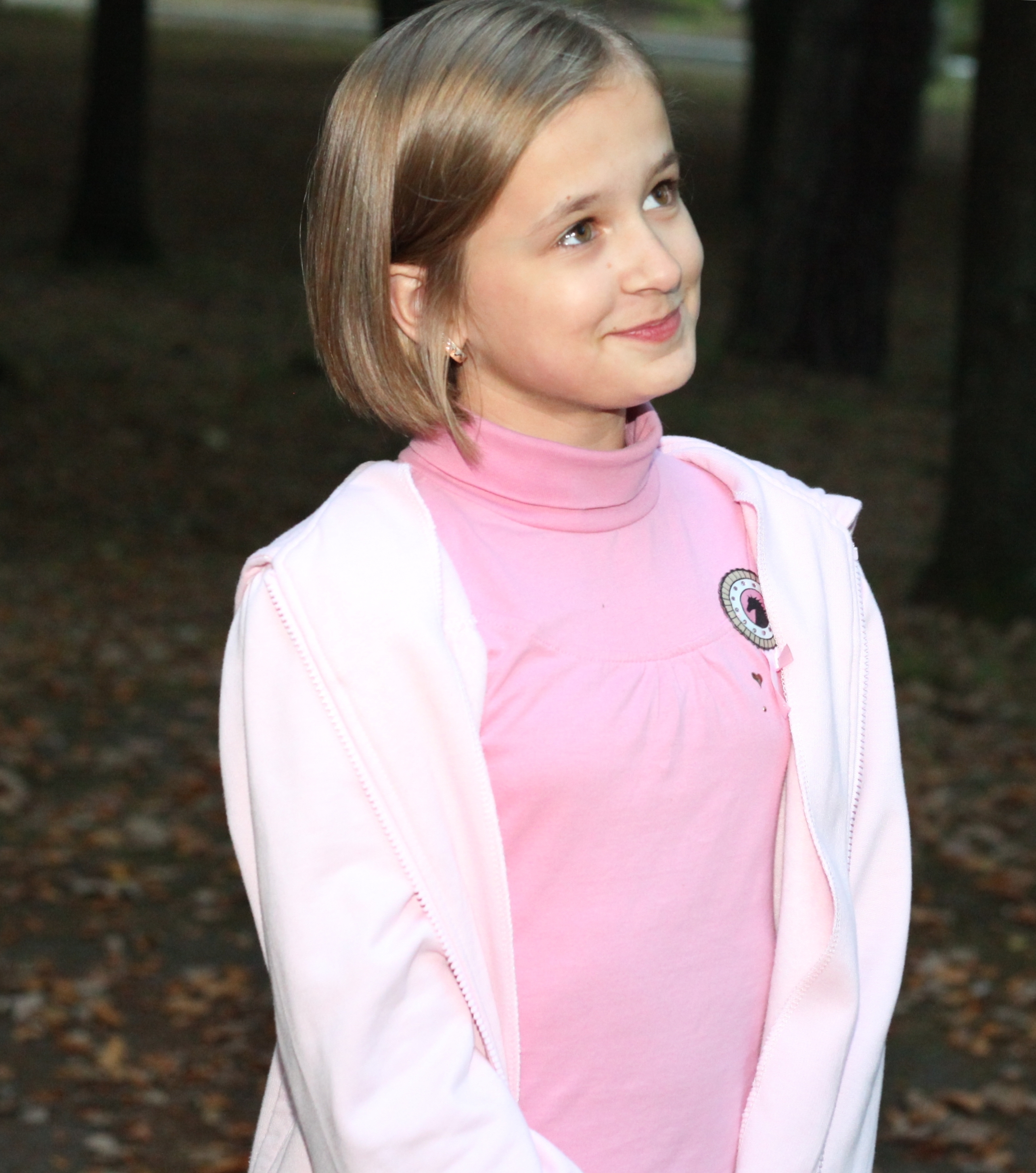 an appealing young Catholic girl in a park, picture 3