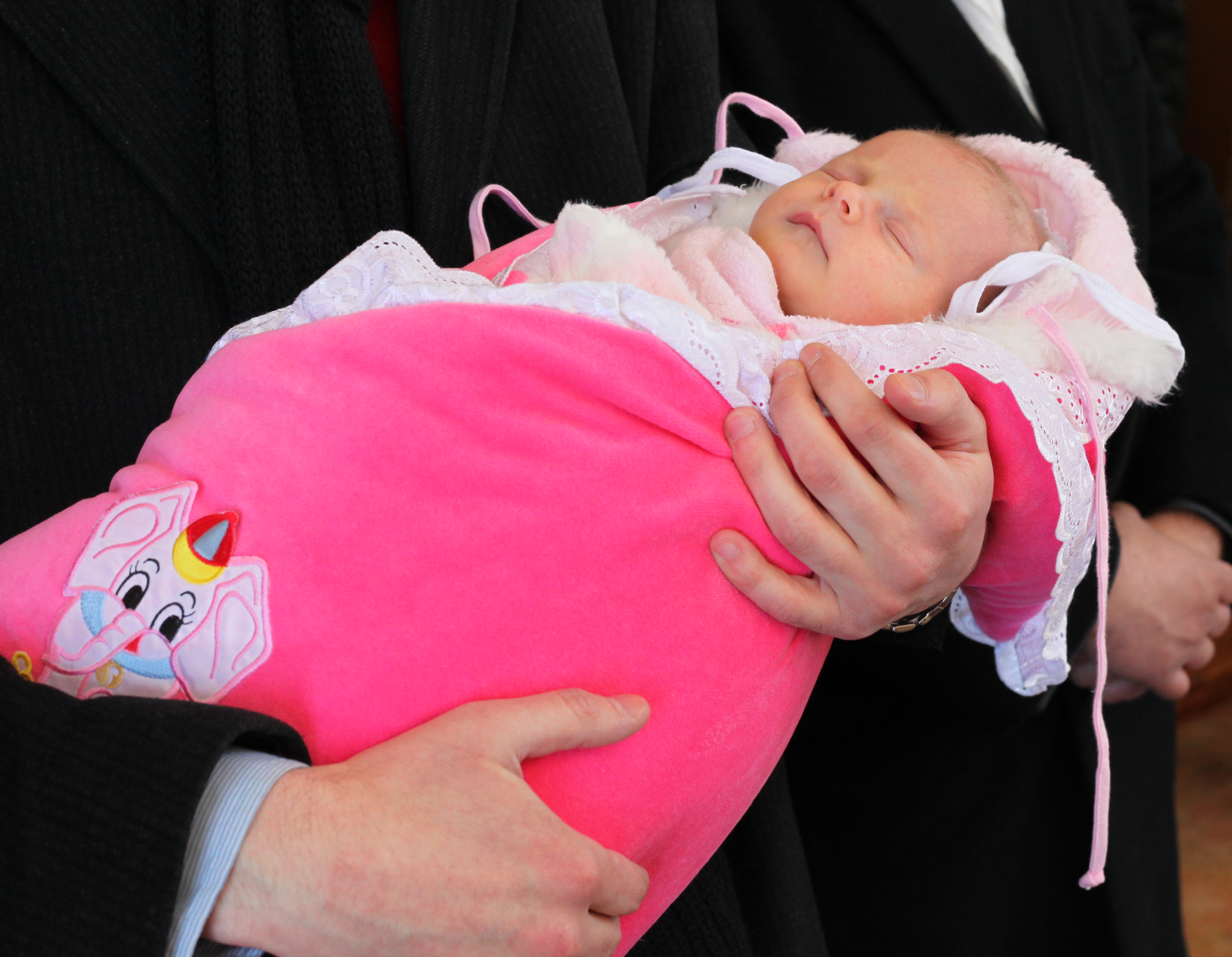 baptism of a baby girl in a Catholic church, picture 3