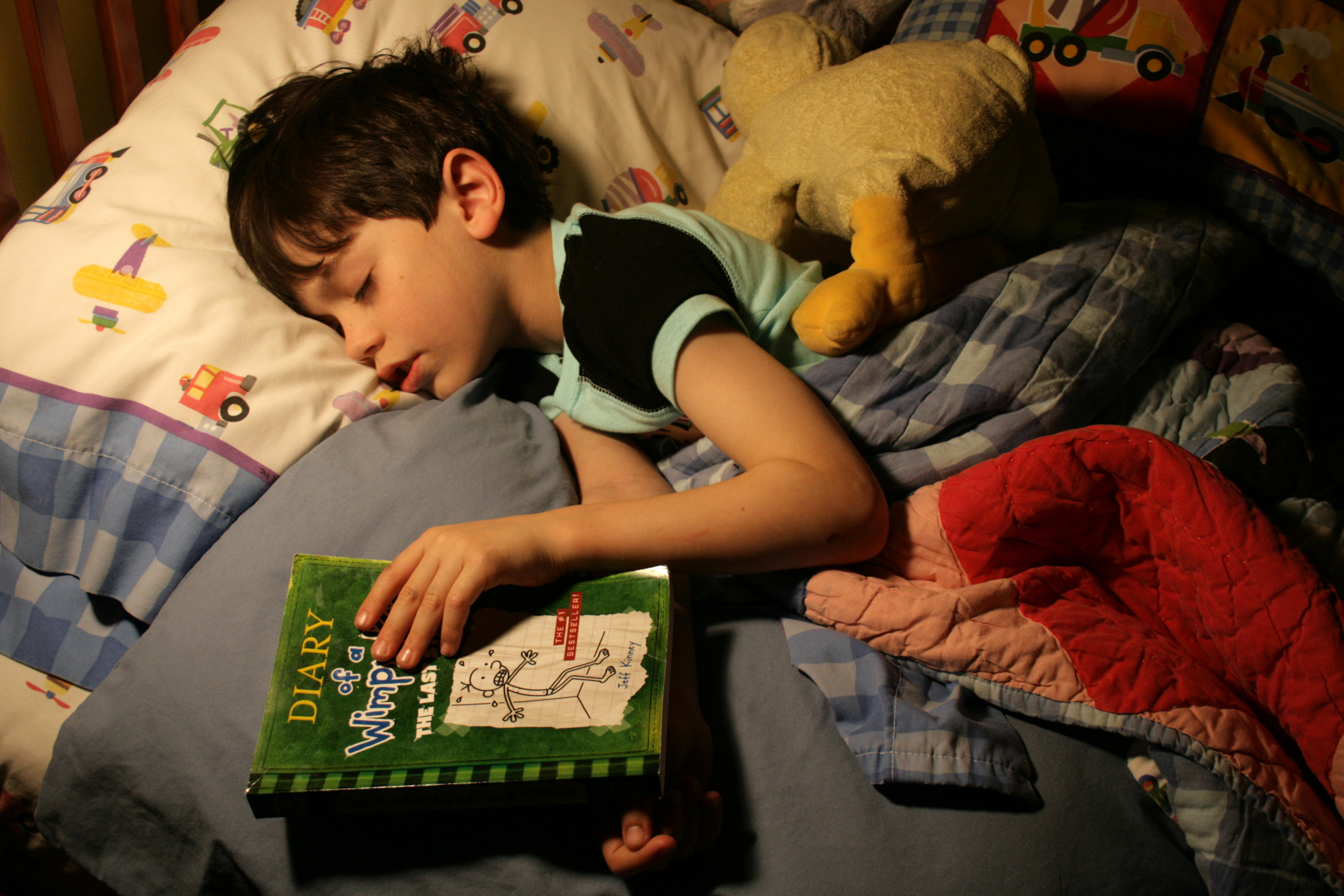 Bedtime reading. Six year old boy reading 