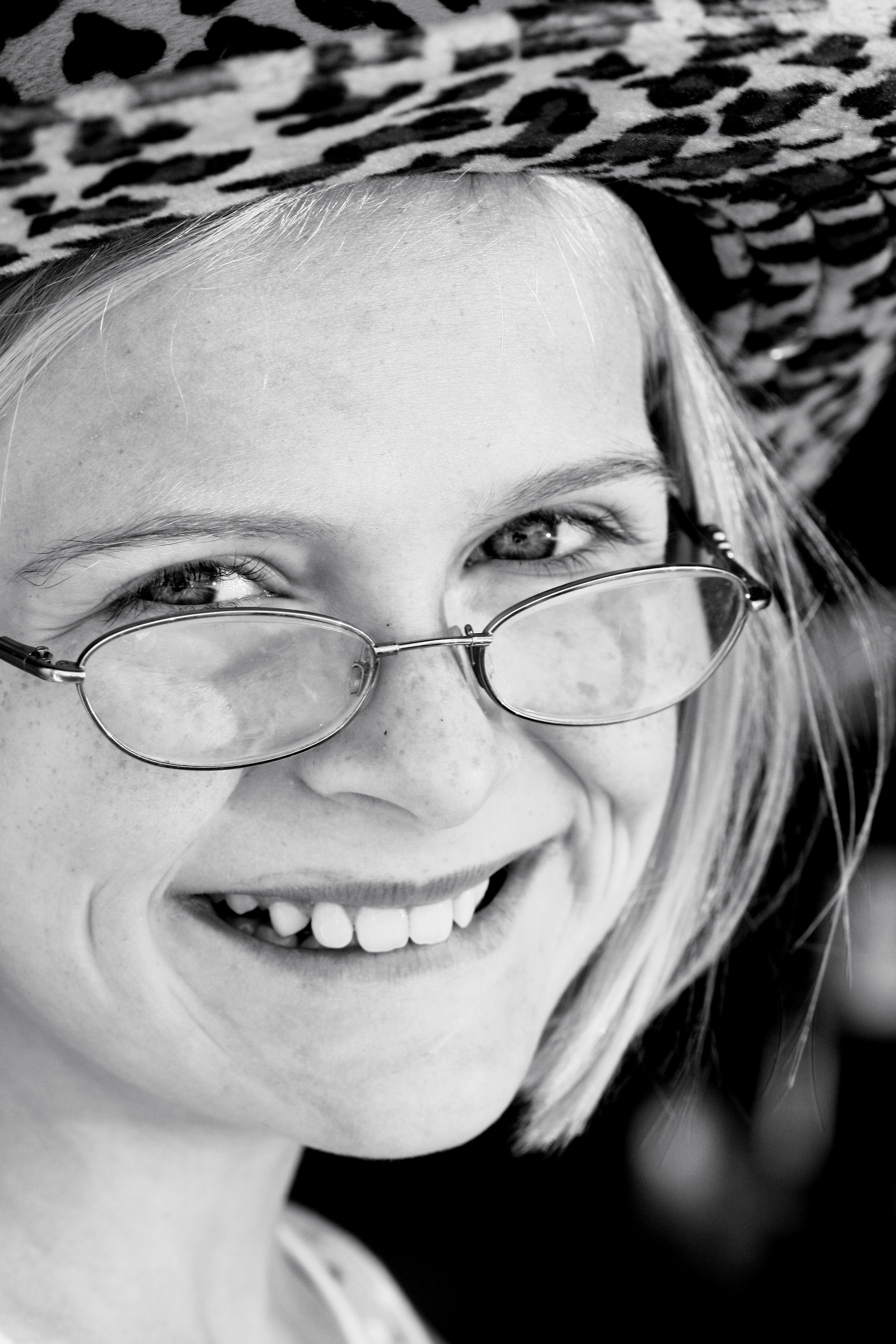 Happy Girl in Glasses Smiling