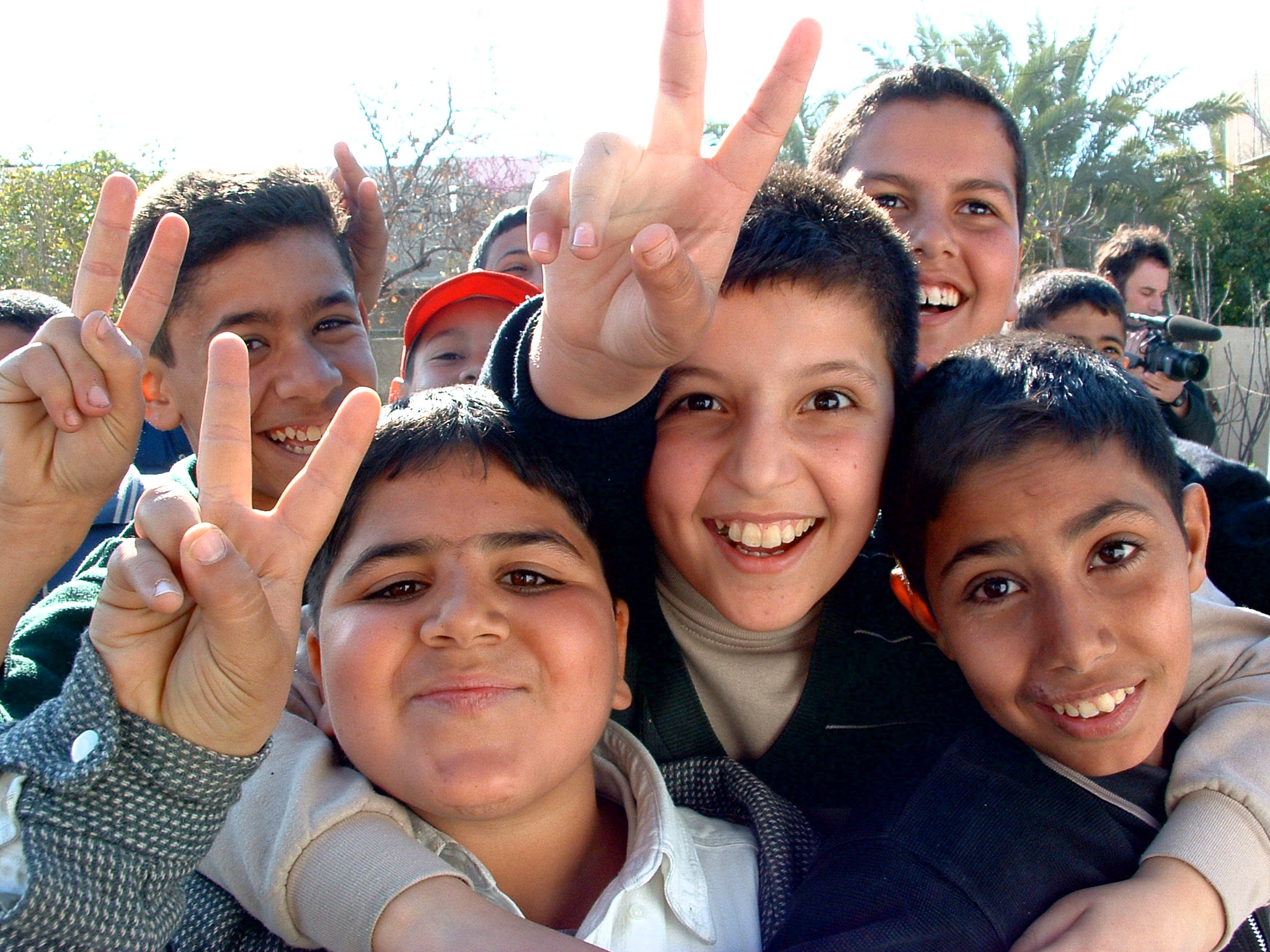Iraqi boys giving peace sign