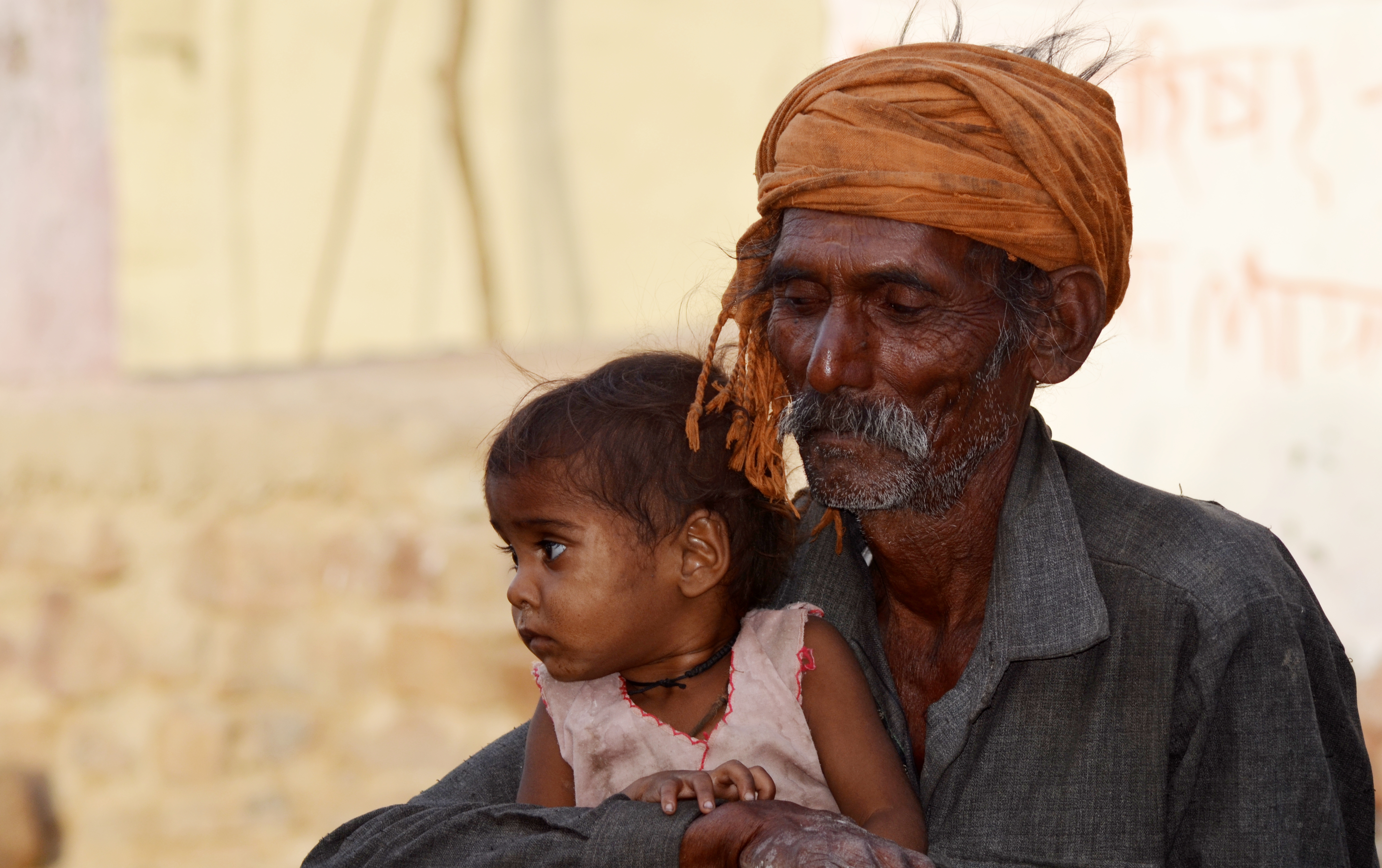 Old man with a baby girl, Morena district