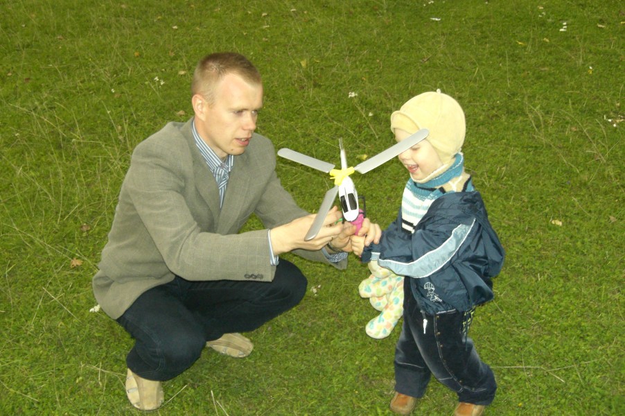 Father, son and a toy helicopter