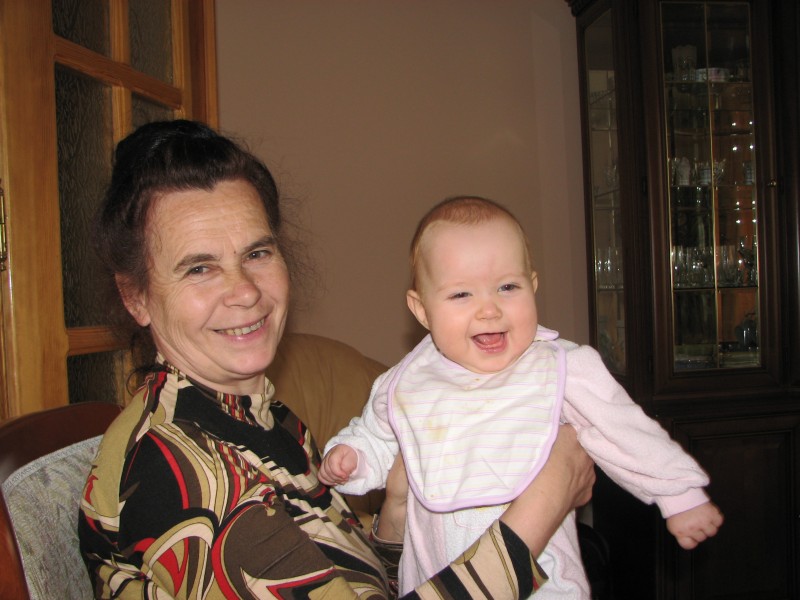 Grandmom with her baby grand daughter, smiling. Family. Picture 2.