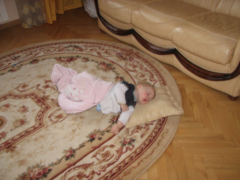 A baby kid girl sleeping on the carpet, picture 049