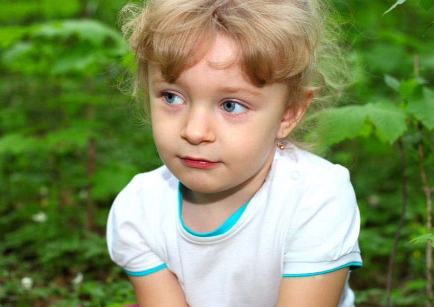 a cute sweet blond child girl in a forest, picture 29