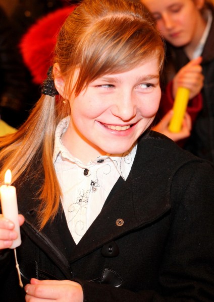 a beautiful smiling Catholic girl in a Church