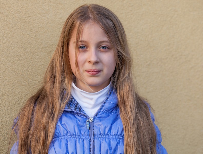 a blond long-haired Roman-Catholic girl photographed in April 2014, portrait 2 out of 11