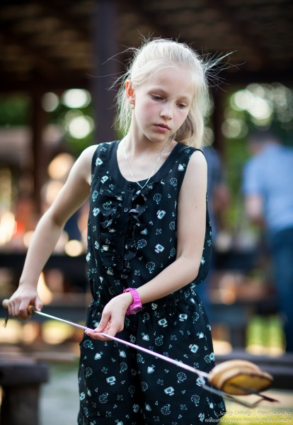a child girl at Catholic recollections in Poland in July 2017, picture 1