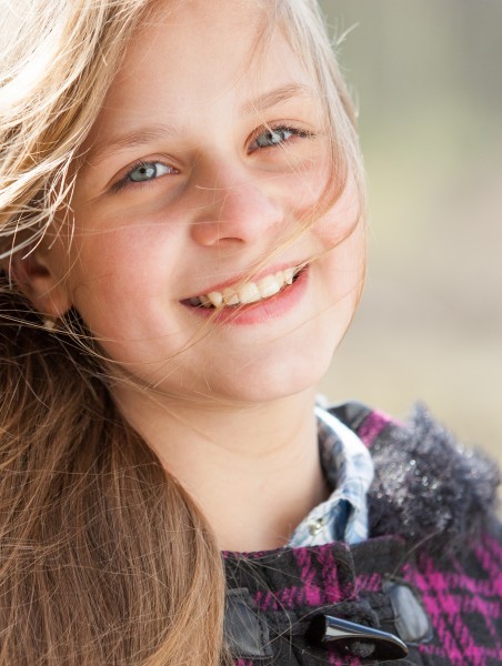 a cute blond 12-year-old girl photographed in April 2015, picture 2