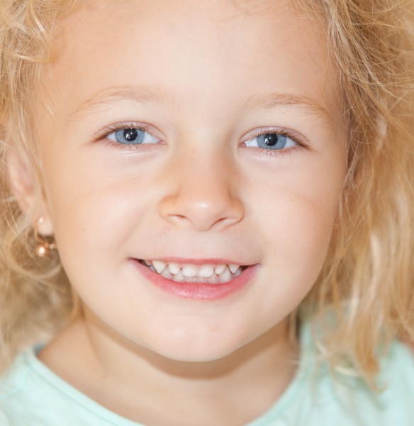 a cute blond child girl photographed in August 2014, picture 5