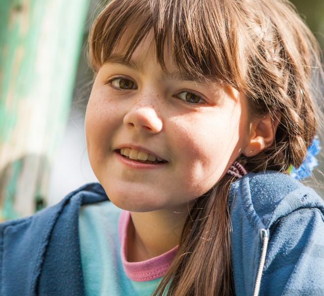 a cute brunette Catholic child girl photographed in May 2014, picture 3/5