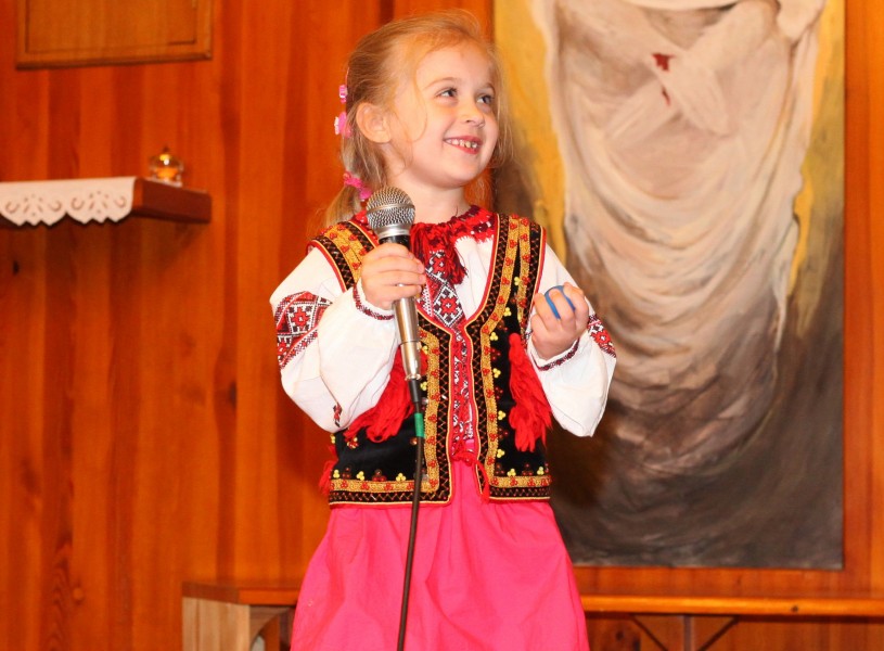 a smiling cute charming beautiful Catholic child girl in a Church, photo 7