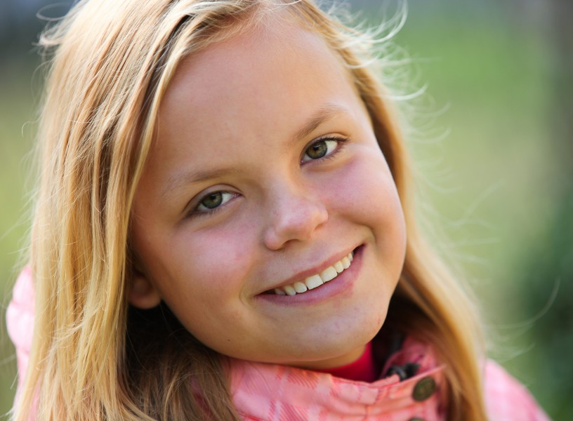 a young blond girl photographed in September 2013, picture 2/4