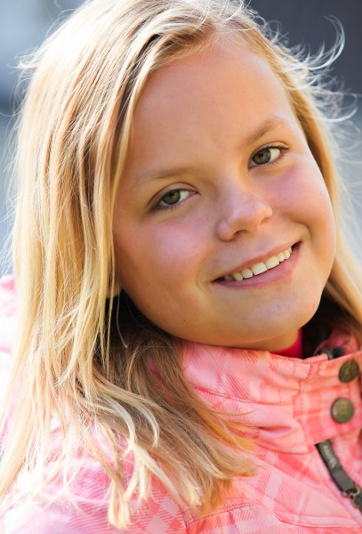 a young blond girl photographed in September 2013, picture 3/4