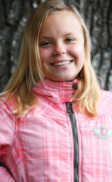 a young smiling blond Catholic girl photographed in September 2013, picture 4/4