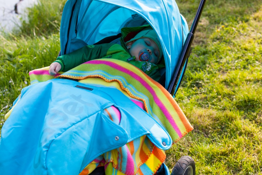 an 11-month-old baby boy sleeping in a pram in May 2014