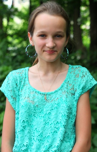 an absolutely beautiful smiling Catholic girl with huge earrings, photographed in June 2013, portrait 19/27