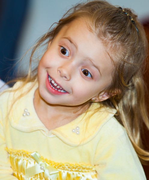 an amazing blond child girl in a Catholic kindergarten photographed in November 2013, picture 3