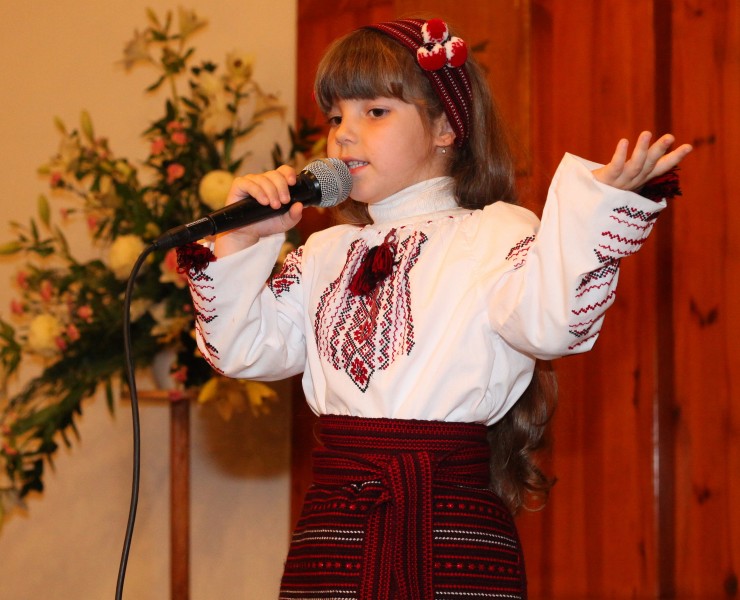 an amazingly beautiful brunette Catholic child girl performing in a Catholic kindergarten, photo 4