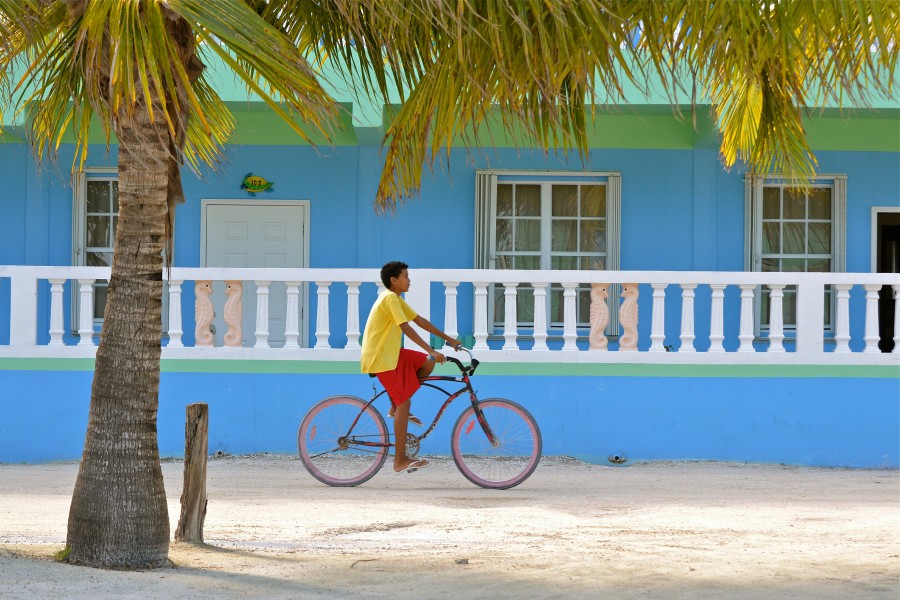a boy riding a bike in Belize
